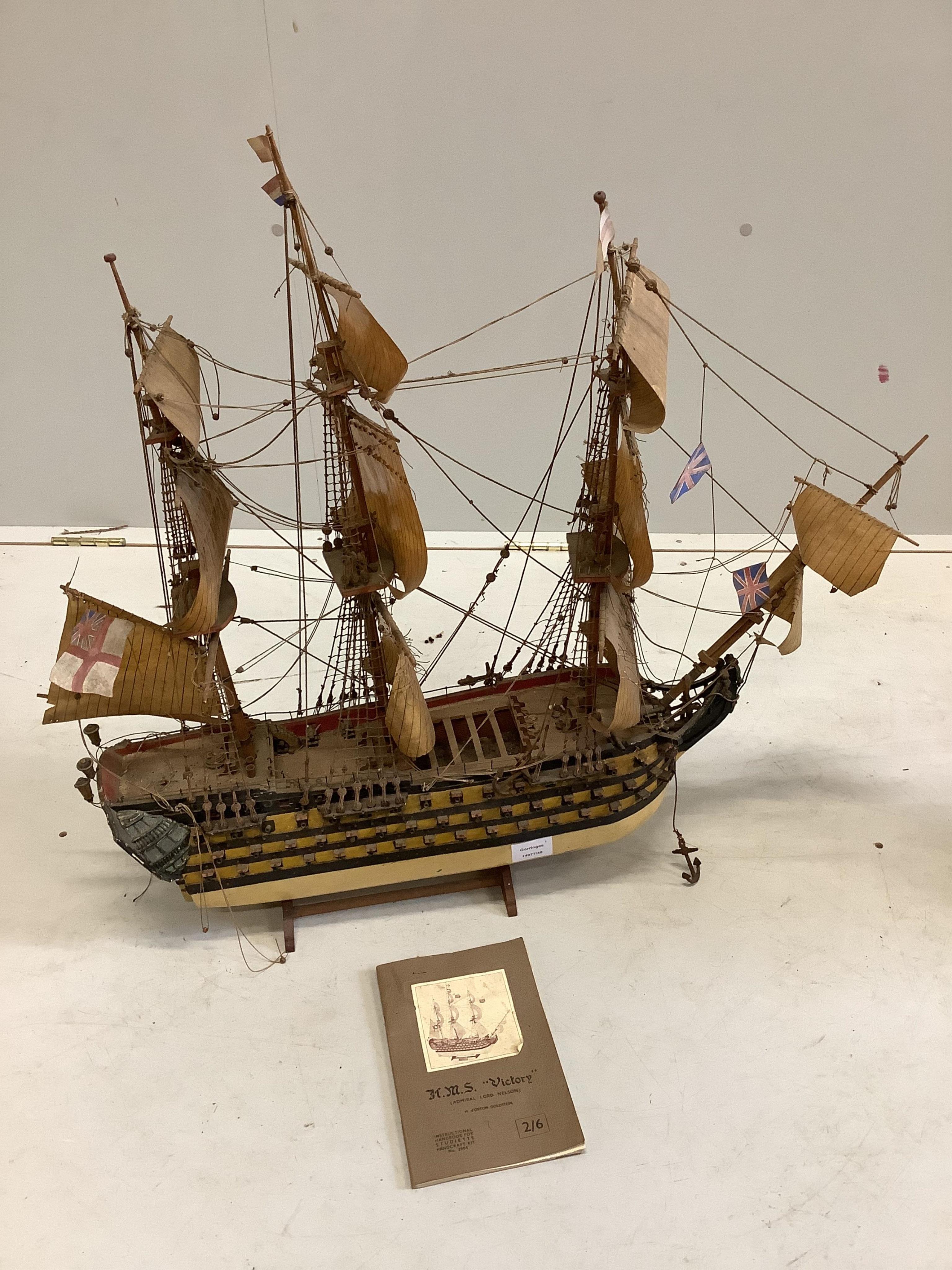 A kit built model of HMS Victory with booklet, length 75cm, together with one other model boat. Condition - fair